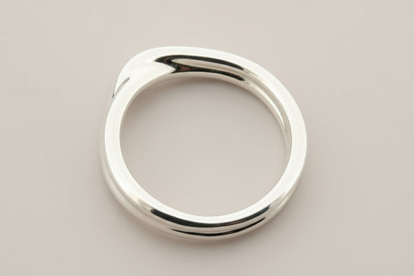 Silver ring on a gray background