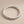 Load image into Gallery viewer, Silver twisted ring on a gray background
