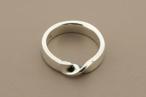 Silver ring on a gray background