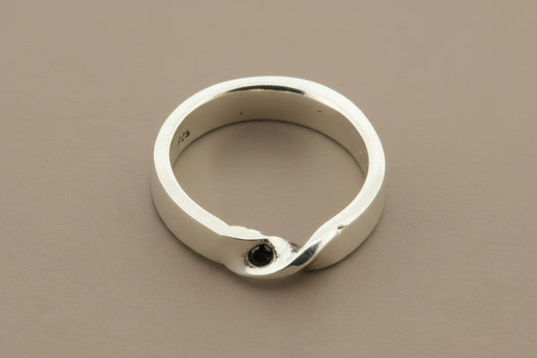 Silver ring on a gray background