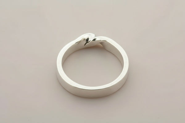 Silver ring on a gray background