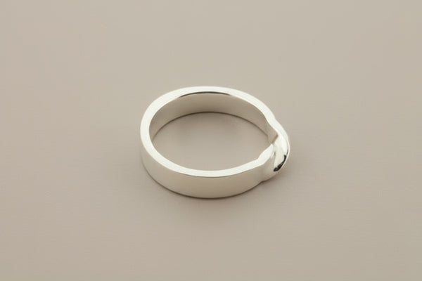 Silver band with twist ring