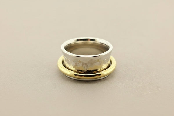 Concave hammered silver ring with brass spinner