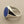 Load image into Gallery viewer, A silver signet ring featuring an oval-cut deep blue lapis lazuli stone, displayed on a textured gray surface.
