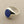 Load image into Gallery viewer, A sterling silver signet ring featuring a round, deep blue lapis lazuli stone, displayed on a textured gray background.
