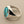 Load image into Gallery viewer, A silver signet ring featuring a large, polished oval turquoise stone with natural brown matrix veining, displayed on a textured dark gray background.
