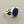 Load image into Gallery viewer, A sterling silver ring featuring a large, smooth oval dark blue lapis lazuli stone, photographed on a textured dark gray background.
