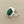 Load image into Gallery viewer, A sterling silver ring featuring a large, oval-cut dark green stone, photographed on a dark gray textured surface.
