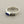 Load image into Gallery viewer, A silver-toned men's signet ring featuring a rectangular deep blue inlay on the front, set against a textured dark gray background.
