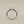 Load image into Gallery viewer, A silver ring featuring a large, rough-cut pale green stone in a prong setting, shown on a dark gray textured background.

