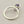 Load image into Gallery viewer, A silver-toned adjustable ring with a small heart-shaped purple gemstone, shown on a dark gray textured background.
