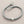 Load image into Gallery viewer, Gray beaded bracelet with silver beads on a gray background
