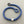 Load image into Gallery viewer, Blue textured bracelet with silver accents on a gray background

