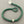 Load image into Gallery viewer, Green beaded bracelet with silver accents on a gray background
