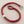 Load image into Gallery viewer, Red bracelet with silver accents on a gray background
