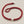 Load image into Gallery viewer, Red bracelet with silver accents on a gray background
