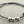 Load image into Gallery viewer, Black cord bracelet with three silver beads on a gray background
