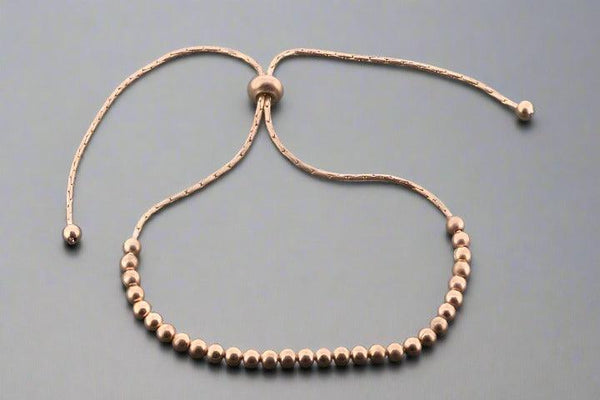 Multi round bead bracelet - rose gold over silver - Makers & Providers