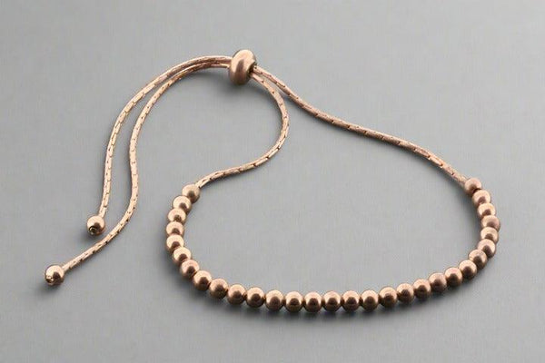 Multi round bead bracelet - rose gold over silver - Makers & Providers