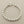 Load image into Gallery viewer, Silver bracelet on a dark gray background
