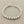 Load image into Gallery viewer, Silver bracelet on a gray background
