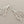 Load image into Gallery viewer, Silver branch-like earrings on a dark gray background
