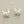 Load image into Gallery viewer, Silver crab earrings with pearl centers on a gray background
