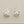 Load image into Gallery viewer, Silver crab earrings with pearl centers on a gray background

