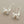 Load image into Gallery viewer, Silver crab earrings with pearl centers on a dark gray background
