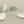 Load image into Gallery viewer, Pair of silver oval earrings on a dark gray background
