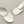 Load image into Gallery viewer, Pair of silver earrings on a dark gray background
