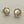 Load image into Gallery viewer, Pair of pearl stud earrings on a dark gray background

