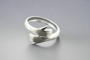 Silver hug ring - Makers & Providers