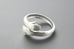 Silver hug ring - Makers & Providers