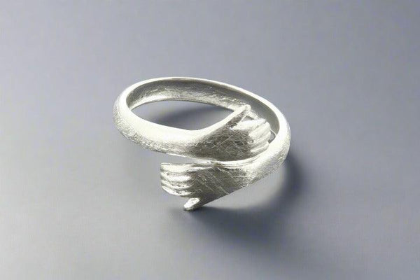Silver hug ring - Makers & Providers