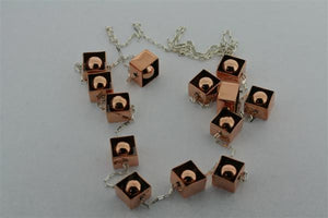 copper framed balls & silver necklace - Makers & Providers