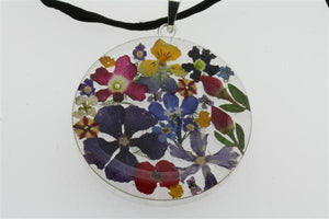 flower/resin pendant - circle on black silk - Makers & Providers