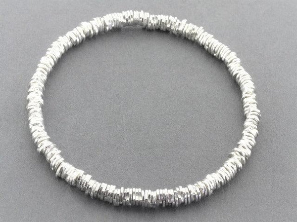 irregular disc bead stacked bangle - sterling silver - Makers & Providers