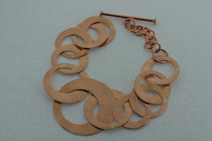 multi scratched copper disc bracelet - Makers & Providers