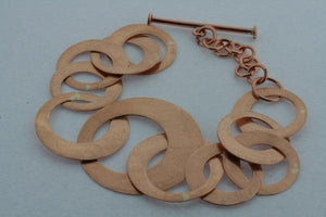 multi scratched copper disc bracelet - Makers & Providers