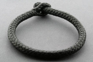 plaited leather bracelet - tubular - black - Makers & Providers