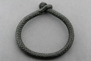 plaited leather bracelet - tubular - black - Makers & Providers