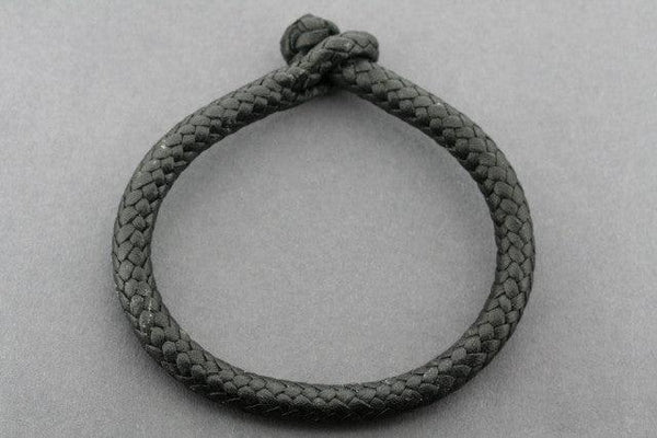 plaited leather bracelet - tubular - black - Makers & Providers