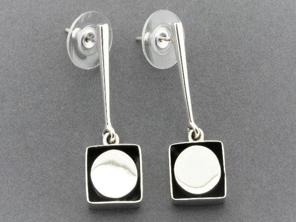 circle framed drop earrings