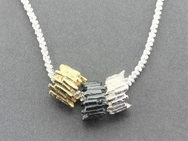 Tubular sticks pendant - Silver , Gold Oxidized on 45 cm chain