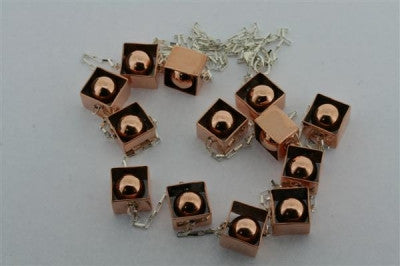 copper framed balls & silver necklace - Makers & Providers