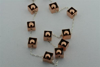 copper framed balls & silver necklace - Makers & Providers