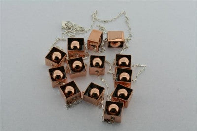 copper framed balls & silver necklace - Makers & Providers