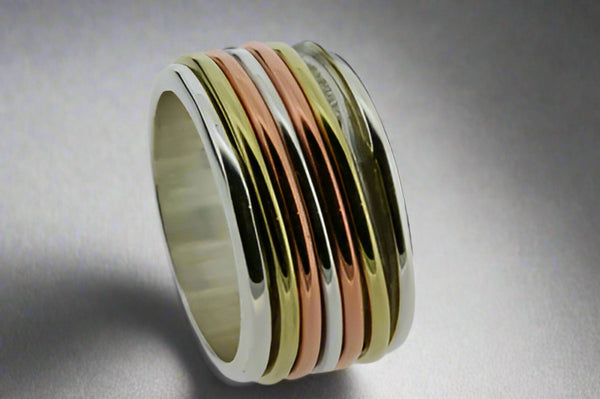 Five Band Polished Silver, Brass & Copper Spinner Ring - Makers & Providers