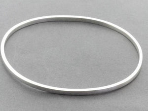 narrow square edged oval bangle - sterling silver - Makers & Providers